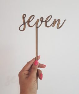 "seven" laser-cut topper