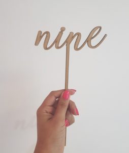 "nine" laser-cut topper