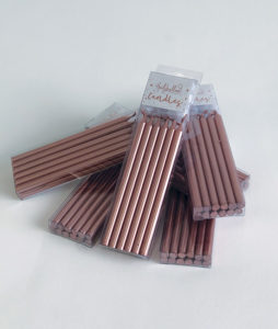 Tall rose gold candles